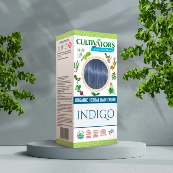 En æske Cultivators Indigo 100g hår foran et velvære træ.